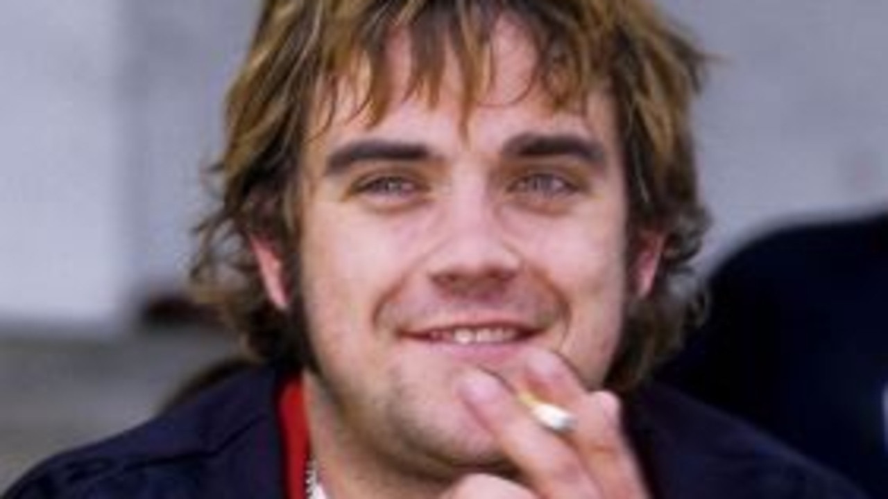 Robbie Williams pictured in 1996, a year after he left boy band, Take That. Picture: Getty Images