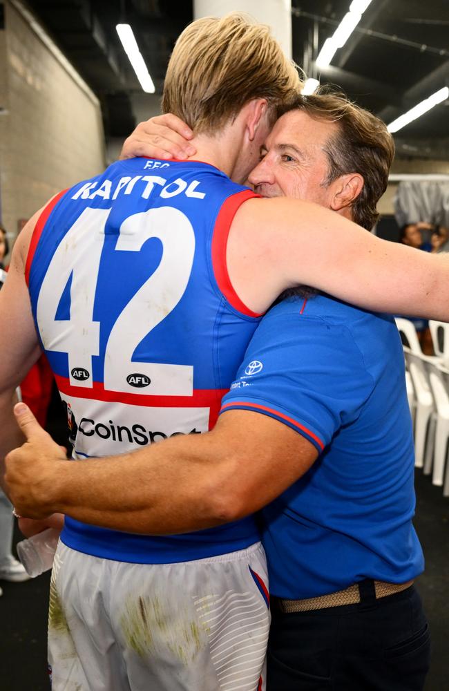 Sam Davidson (left) and Luke Beveridge share a hug after the round 3 win over Carlton. Picture: Quinn Rooney/Getty Images