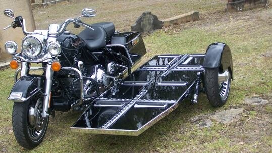 The new black and chrome Harley Davidson Road King with its 1690cc power unit, and coffin tray.