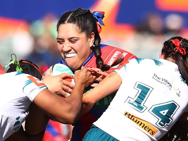 CANBERRA, AUSTRALIA - AUGUST 03: Rima Butler of the Knights is tackled during the round two NRLW match between Canberra Raiders and Newcastle Knights at GIO Stadium on August 03, 2024 in Canberra, Australia. (Photo by Mark Nolan/Getty Images)