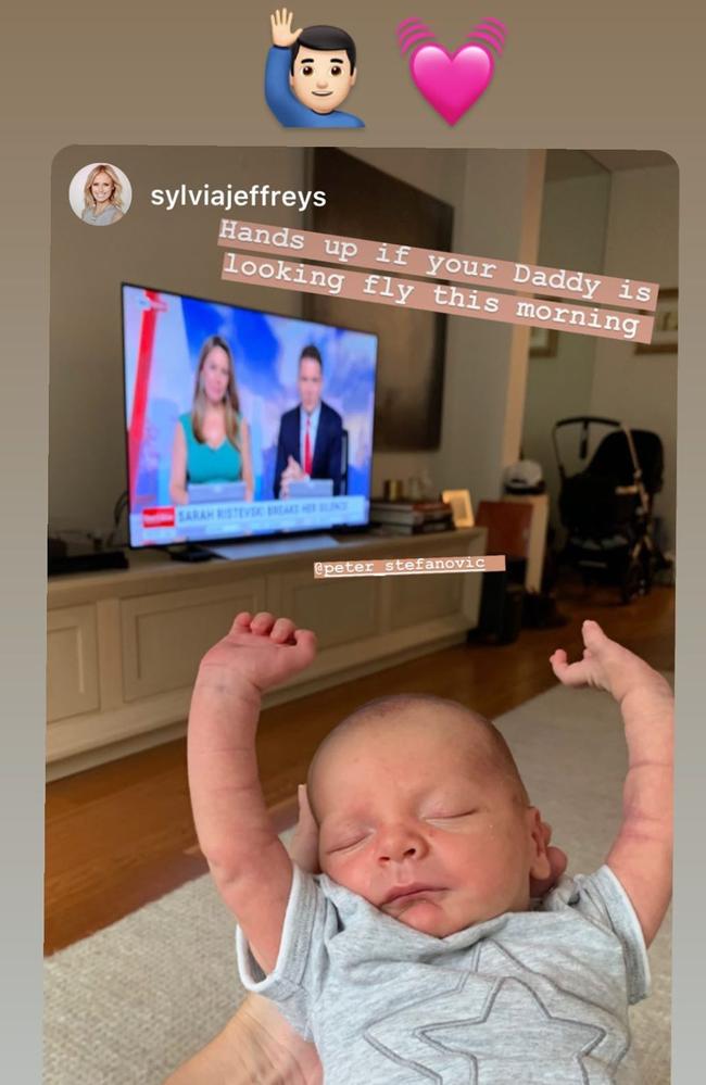 Baby Oscar with dad Pete Stefanovic on TV behind him.