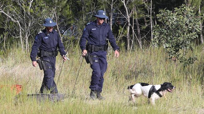 Police comb the area around Scrubby Creek. A jury has been told of the final moments of Mr Breton and Ms Triscaru as four men stand trial accused of their murders. Picture: Jono Searle.