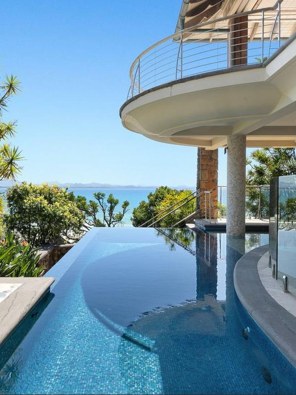 The luxury home includes a gorgeous swimming pool.