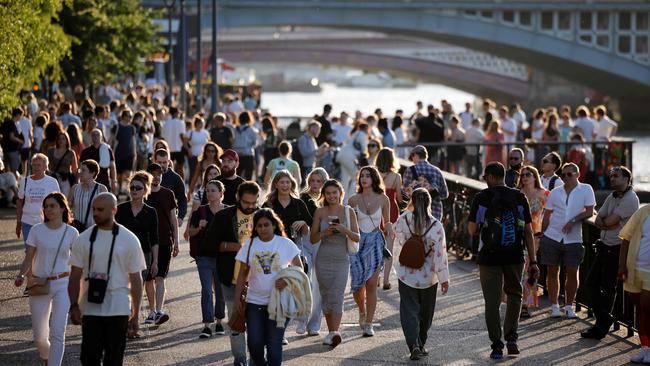 People enjoy the evening sunshine on the Thames Embankment in London as the UK approaches Freedom Day and the scrapping of pandemic rules. Picture: AFP