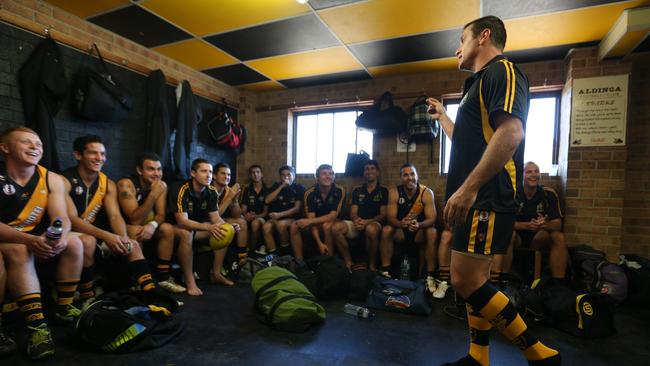 Shane Crawford talks to Aldinga Sharks team mates before the match. Picture: Tait Schmaal