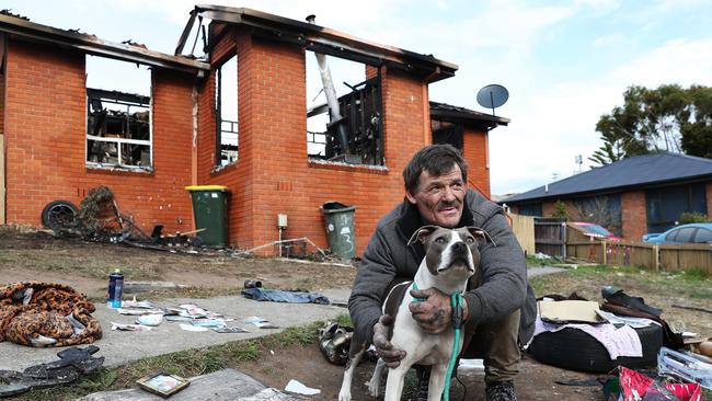 Resident Todd Kelly with his dog Zahli who he saved from the burning house with his other dog 16 year old Bonnie perishing. House fire at Robbins Place West Moonah where a pet dog of the owner died. Picture: NIKKI DAVIS-JONES