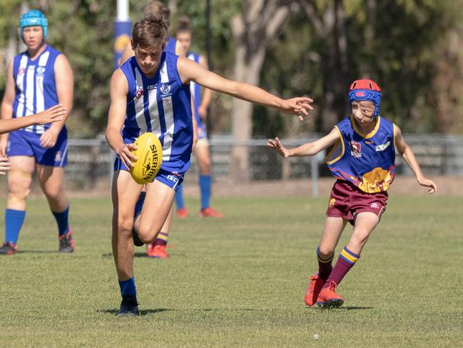 Nicholas Daisley in action for the Glenmore Bulls alongside older players. Picture: Steve Vit