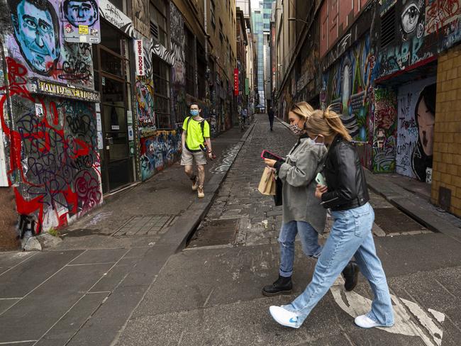 MELBOURNE, AUSTRALIA - NCA NewsWire Photos December 7, 2020:   People wearing face masks are seen at Hosier Lane in Melbourne, Victoria. Picture: NCA NewsWire / Daniel Pockett