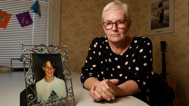 Adelaide mother and suicide bereavement trainer Jill Chapman with a photo of her son Michael on his 15th birthday. Michael took his own life in 2001. He was 16. Picture: Tricia Watkinson