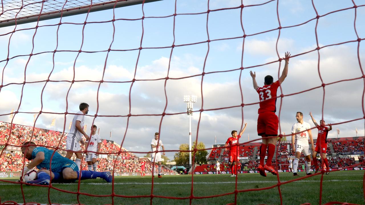 Wellington’s Filip Kurto tries to stop Adelaide United’s Apostolos Stametlopoulos goal at Coopers Stadium on Sunday. Picture: Kelly Barnes/Getty