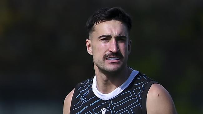 Zak Butters of the Power  in pain behind  Ivan Soldo of the Power during Port Adelaide  training at Alberton Oval Tuesday,August,20,2024.Picture Mark Brake