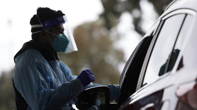 Medical staff conduct tests at the Merrylands drive-through clinic on Saturday July 10. Picture: Brook Mitchell/Getty Images