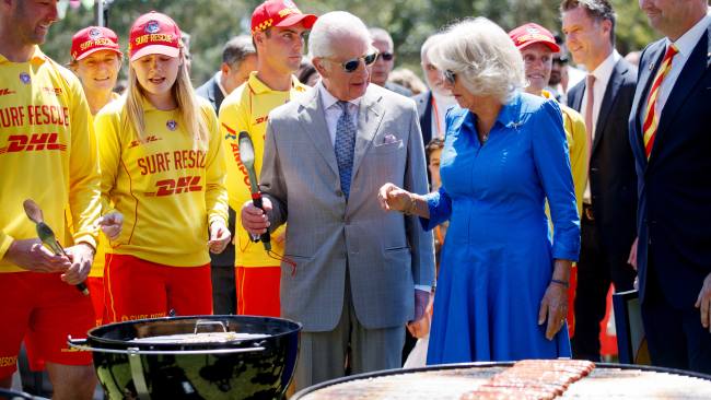 The royals showcase their cooking skills by flipping some snags on the BBQ. Picture: NewsWire / Nikki Short