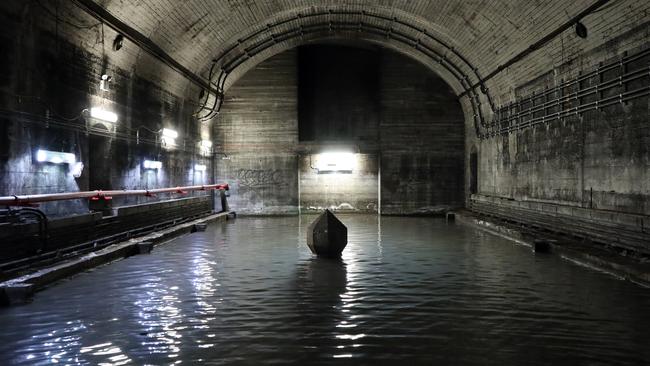 Access to the labyrinth at St James station tunnels is via a passageway entry, seen on the back wall. Picture: Andrew Murray.