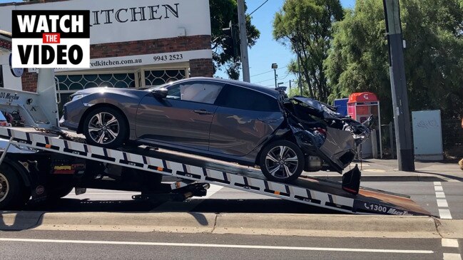 Mangled car being towed after crash in Glen Iris