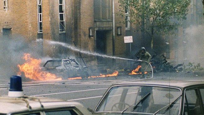 A fireman hosing after the Russell Street bombing.