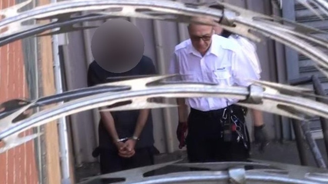 The man being escorted into court after his arrest. Picture: 7NEWS