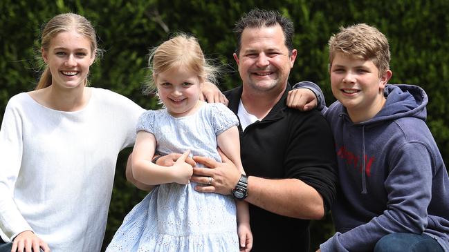 Pride of Australia entrant and former police detective Simon Gillard at home with his children Lily, Adella and Cooper in Wahroonga, Sydney. Picture: Brett Costello