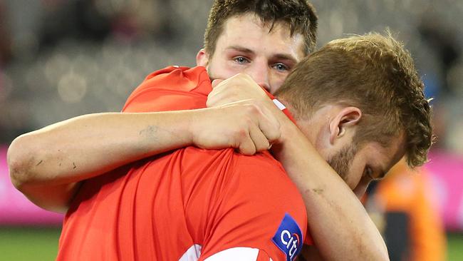 An emotional Nic Newman hugs Johnson after Sydney’s big win over Melbourne. Picture: Michael Klein