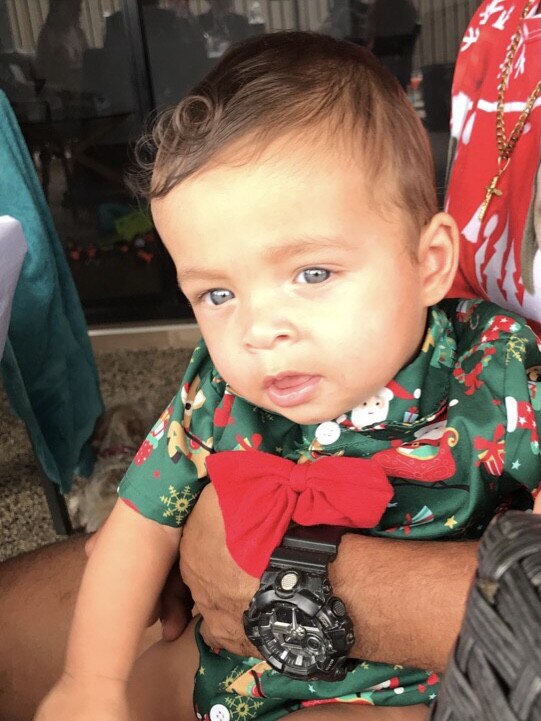 Obi William Norris celebrating his first Christmas at a friends’ home in Zuccoli.