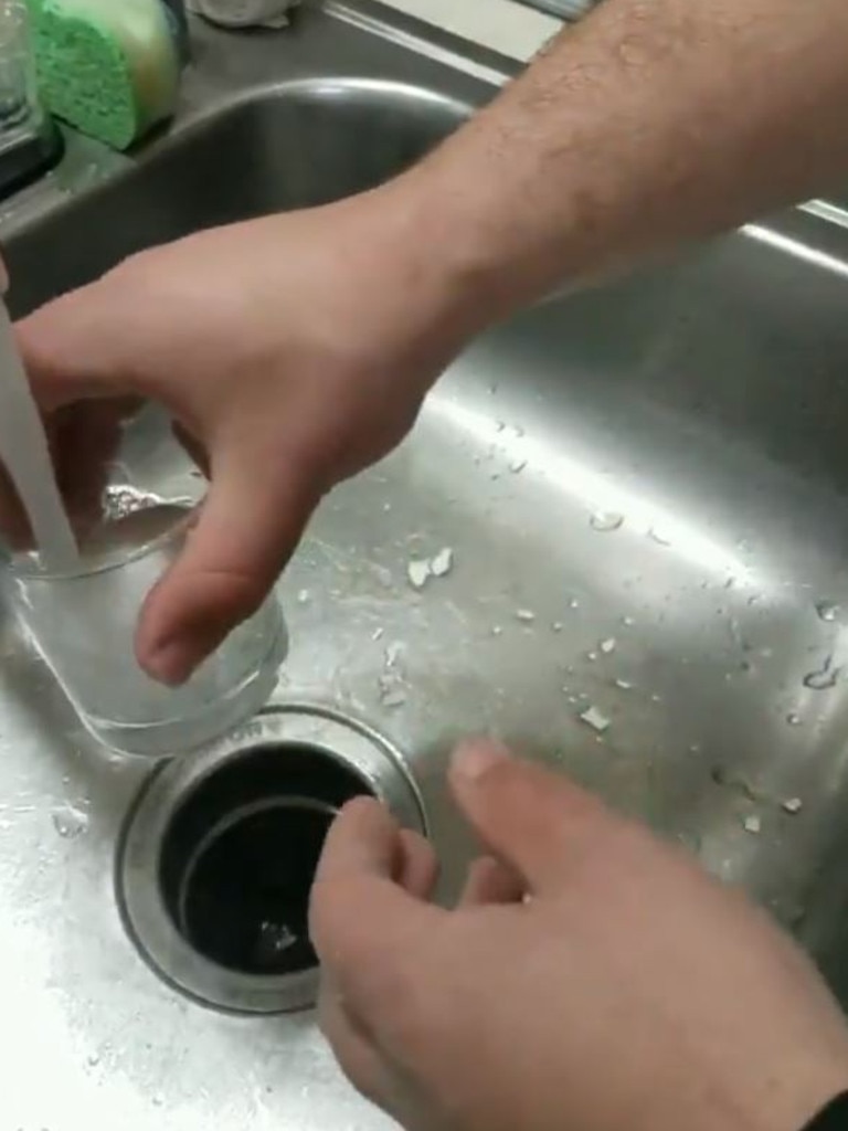In the clip a man pops a freshly boiled egg into a glass and fills it with water. Picture: Twitter