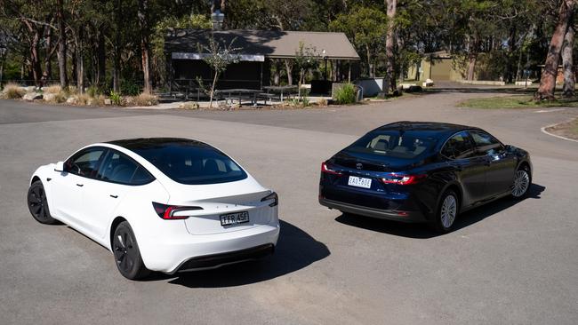 Tesla Model 3 and Toyota Camry Hybrid. Photo: Camber Collective