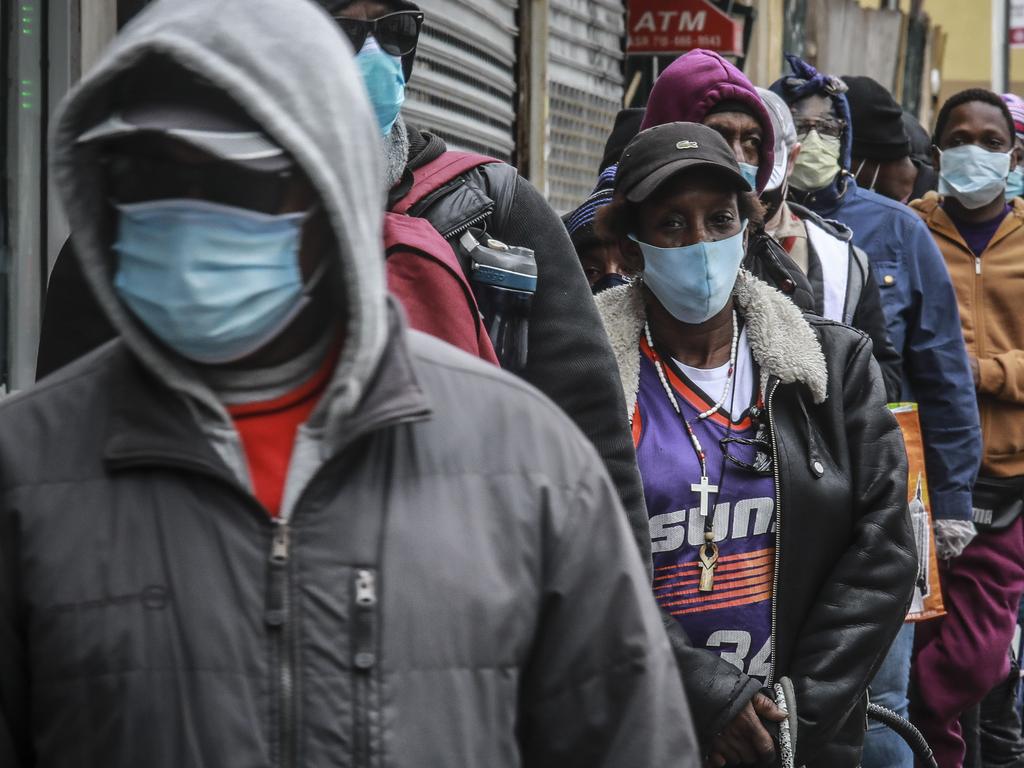 People wait for a distribution of masks in NY. Picture: AP
