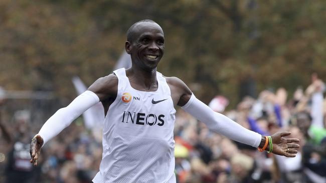 Kenyan Eliud Kipchoge celebrates after becoming the first runner to complete a marathon in under two hours. Picture: AP