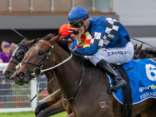 Mark Zahra drives Vibrant Sun to the line in the G1 Australasian Oaks. Picture: Makoto Kaneko.