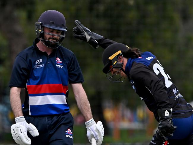 Melbourne UniversityÃs Noah Croes celebrates the wicket FootscrayÃs Ryan J Stingel during the Victorian Premier Cricket Footscray v Melbourne University match in Footscray, Saturday, Nov. 26, 2022. Picture: Andy Brownbill