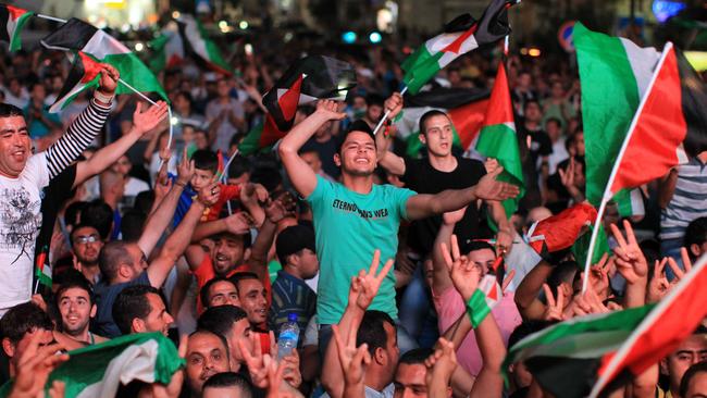 Palestinians celebrating in the West Bank after Palestine qualified for their maiden Asian Cup.