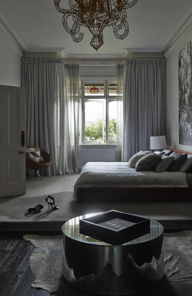 The main bedroom has a grey colour palette. Photo: Nikole Ramsay