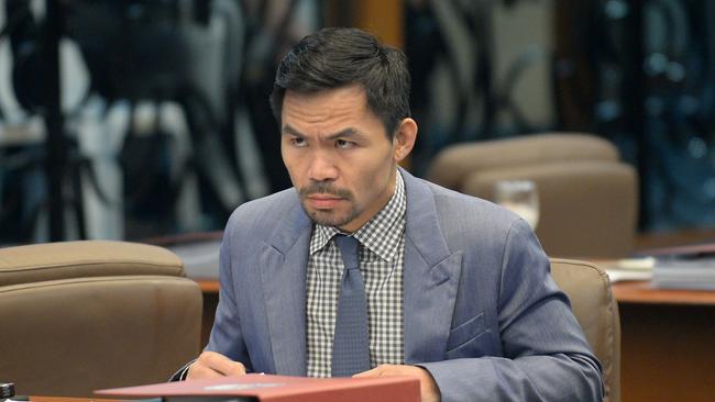 Senator Manny Pacquiao attends a Senate session in Manila earlier this year. Picture: AFP/Ted Aljibe