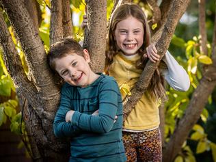 Cross siblings Thomas (6) and Emily (9) have signed up to be part of a trial into sore throats in children. It is hoped the results from the study will help researchers develop a vaccine for step A infections. Picture: Jake Nowakowski