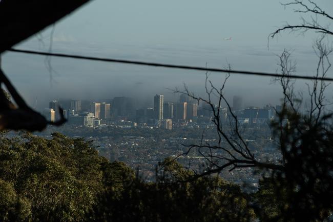 Fog drifts over Adelaide CBD. Picture: Brad Fleet