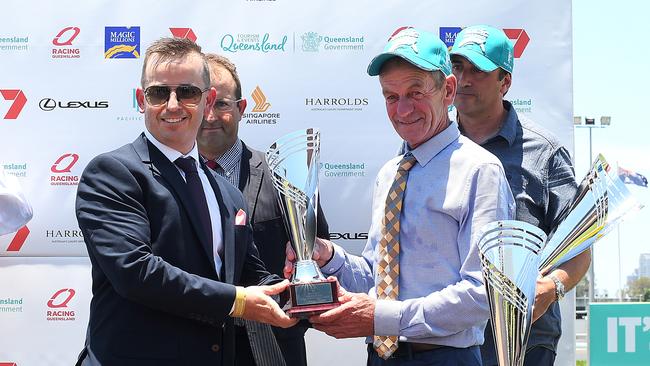 Trainer Gerald Ryan (right) poses for a photo after Problem Solver the Magic Millions Maiden Plate. Picture: Albert Perez, AAP Image.