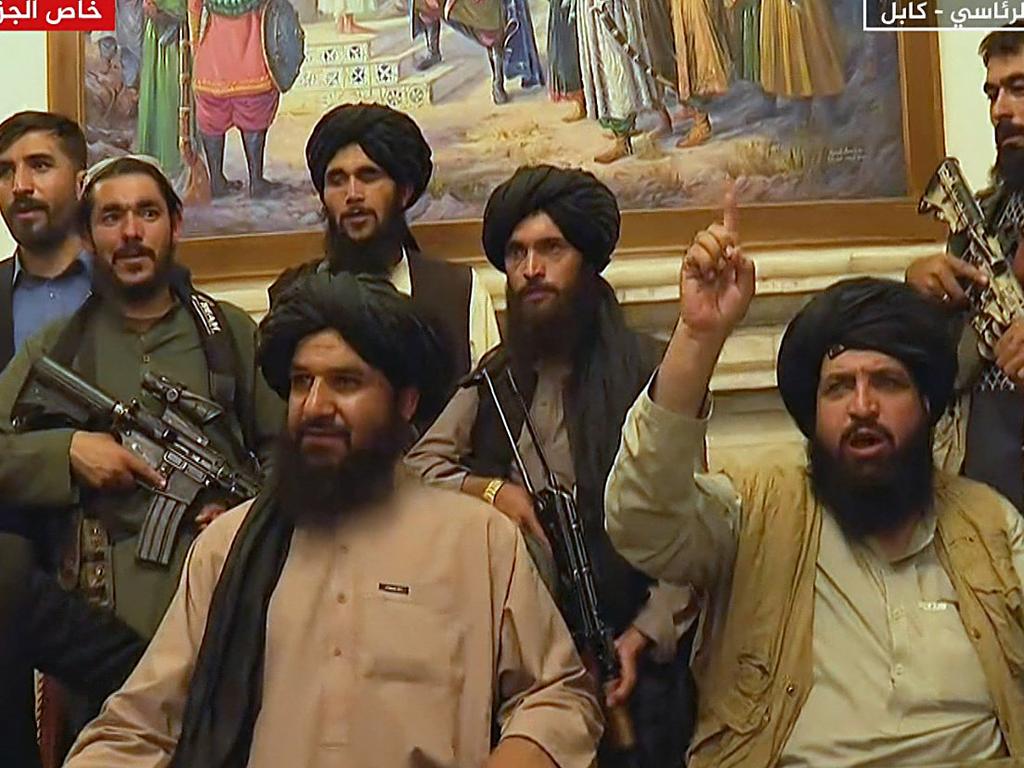 Members of Taliban taking control of the presidential palace in Kabul after Afghanistan's president flew out of the country.