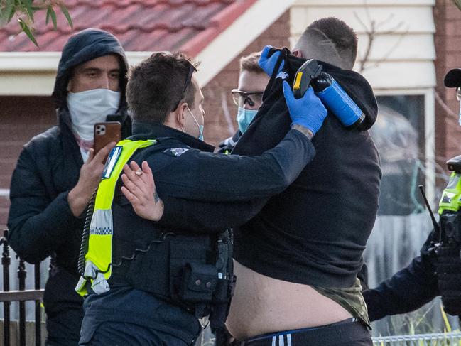 Police threatened to use pepper spray in a tense stand-off with anti-lockdown protesters in Dandenong. Officers clashed with a group of about 100 people who marched along Kirkham Rd about 5.20pm. Picture: Jason Edwards