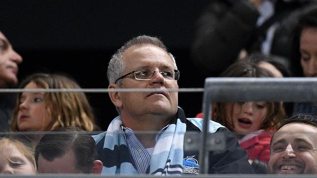 Prime Minister Scott Morrison watches the Roosters-Sharks clash at Allianz Stadium.