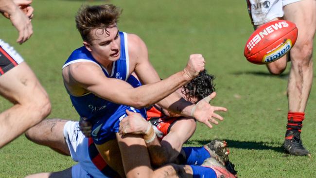 AUGUST 14, 2021: Saints James Higgins handballs during the Adelaide Footy League division one match between St Peter's Old Collegians and Rostrevor Old Collegians at Caterer Oval. Picture: Brenton Edwards