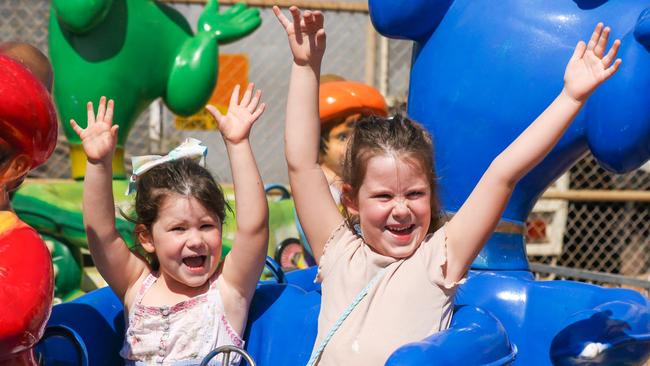 Poppy, 4, and Ivy, 6, Pearson enjoying the third and final day of the Royal Darwin Show. Picture: Glenn Campbell