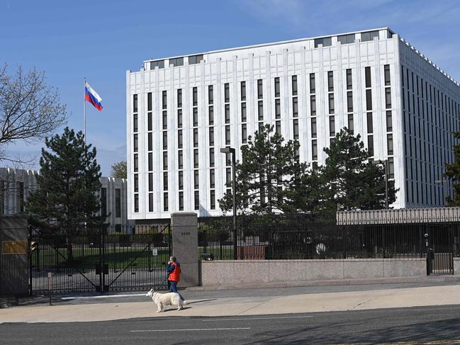 A person walks past the Russian Embassy in Washington, DC, after the White House announced sanctions against the country. Picture: AFP