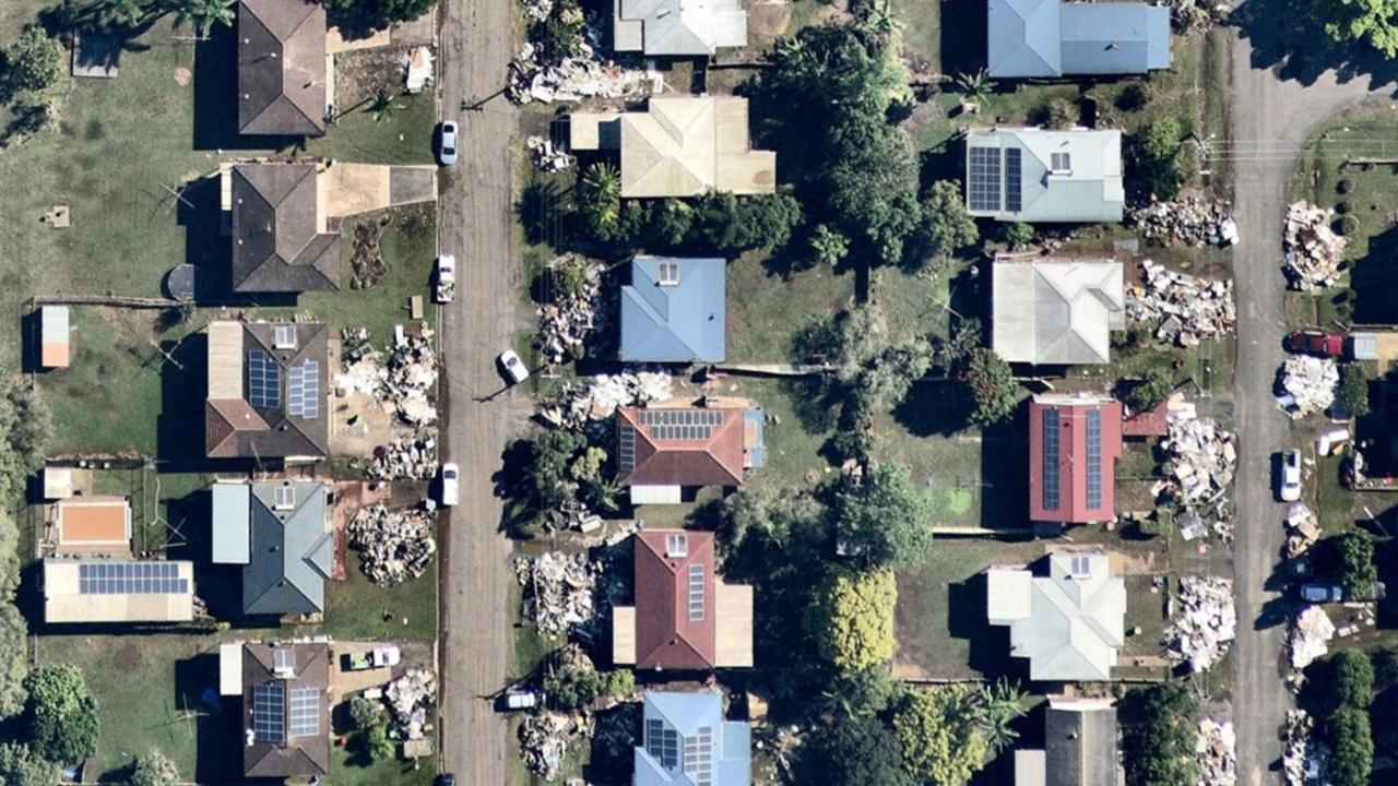 The rubbish piled up in front of South Lismore homes. Aerial imagery by Nearmap