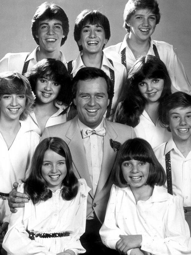 Johnny Young, centre, with Young Talent Time stars (L-R) Bobby Drieson, Joey Perrone, Michael Campbell, Karen Dunkerton, Tina Arena, Jodie Loebert, Mark McCormack, Dannii Minogue and Katie Van Ree in 1984.