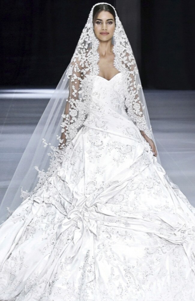 Aussie designers Ralph &amp; Russo have been named as favourites to design the dress, which will be paid for by the couple.