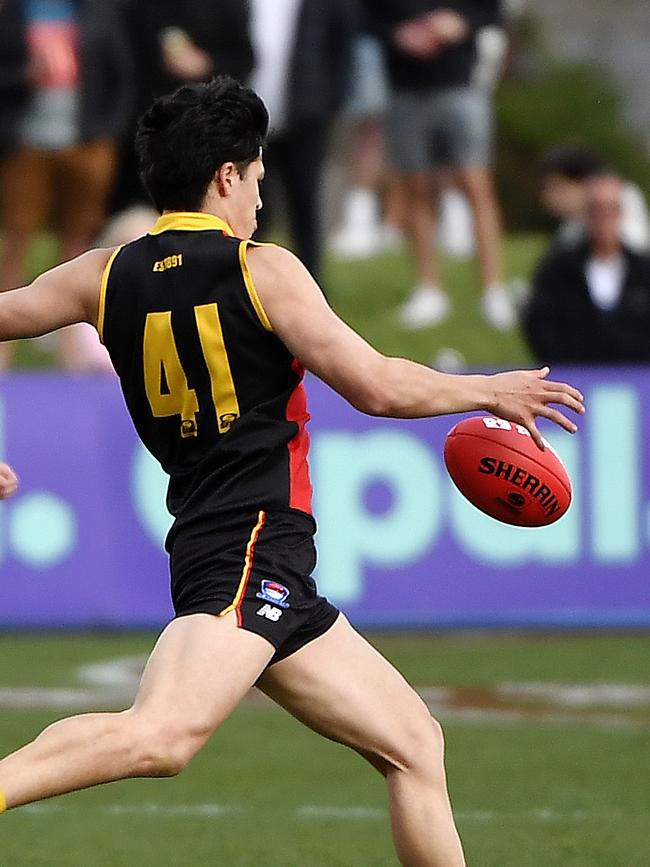 Josh Lai launches Cheltenham forward during the Southern footy league Grand Final. Picture: Andrew Batsch