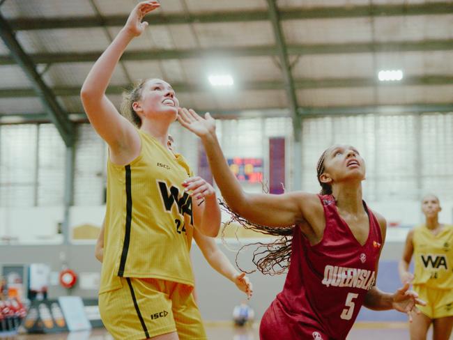 Western Australia's Harriet Ford and Queensland's Lulu Twidale battle for the ball at the Under-20 National Championships. Picture: Lara Sinclair