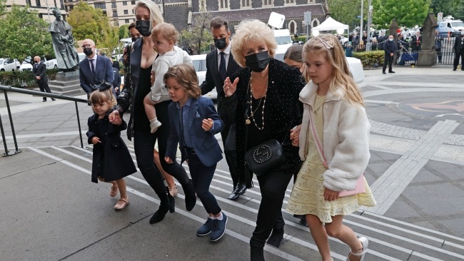 Patti Newton alongside her six grandchildren and daughter Lauren arriving at the state funeral for Bert Newton. Picture: Alex Coppel