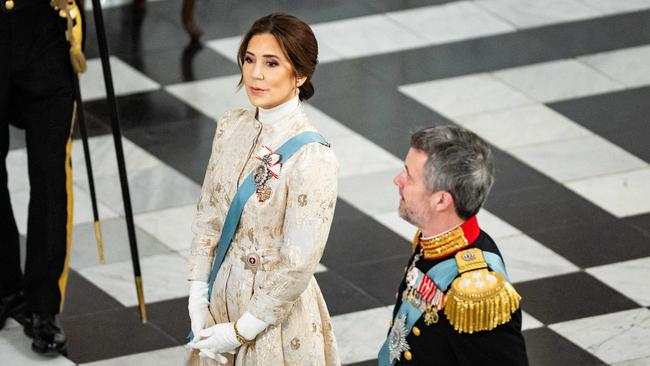 The Queen’s elegant dress featured gold brocade, diamond earrings and white gloves. Picture: Emil Nicolai Helms / Ritzau Scanpix / AFP