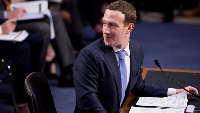 Mark Zuckerberg listens to an aside during the hearing. Picture: AFP.